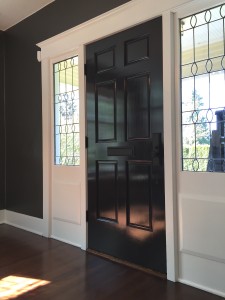 A black, high gloss paint done on the interior of a front door